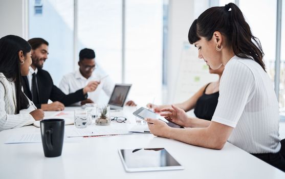 Woman, office and tablet at business meeting with analytics, planning and reading data with people. Corporate teamwork, mobile touchscreen tech or together for documents, finance or strategy