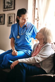 Youre in good hands. a female nurse chatting to her senior patient.