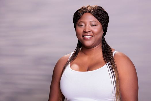 Smiling natural beautiful african american body positive woman portrait