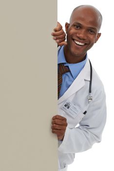 Endorsing your healthcare message. A young african doctor standing behind a blank board that can be used for copyspace.