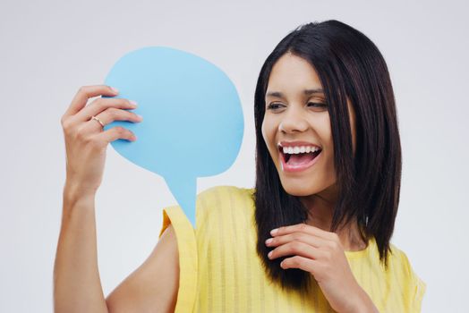 Be the voice of confidence you need. an attractive young woman looking surprised while holding a speech bubble against a grey background.