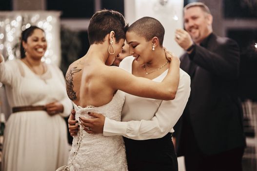 Wedding, love and dance with a lesbian couple in celebration of their union together at a ceremony of tradition. LGBT, woman or diversity with a female and partner dancing after being married