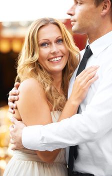 Love, couple and hug at party, smile and celebration for wedding, relationship and happiness for romance. Portrait, man and woman embrace, romantic or excited for marriage, loving or bonding together.
