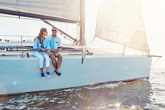 Couple, yacht cruise and ocean in summer with sunshine, love and romance on outdoor adventure. Happy couple, boat and sea with waves, bonding and peace with luxury, lifestyle and travel for holiday.