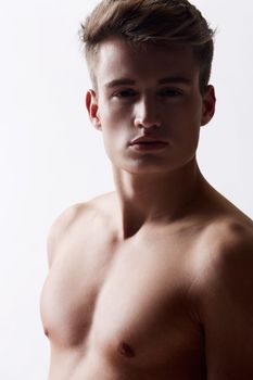 My unique look. Close up portrait of young man wearing no shirt.