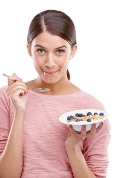Happy, woman and healthy breakfast bowl of cereal for eating against white studio background. Portrait of isolated young female model smiling holding muesli with fruit for health, nutrition or fiber
