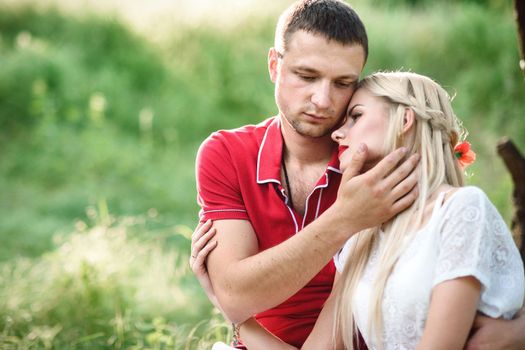 couple in love at a picnic in a park with green grass