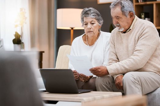 Laptop, documents and retirement with a senior couple planning their savings or investment portfolio. Budget, finance and pension with a mature man and woman working on a computer together in a home