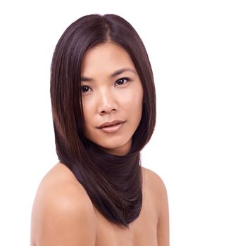 Oriental beauty. Cropped portrait of a beautiful young asian woman against a white background.