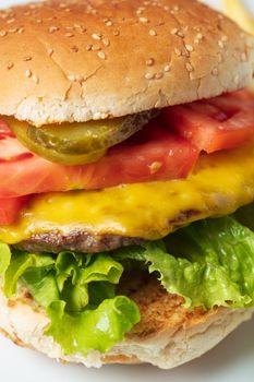 Cheeseburger with tomato and lettuce