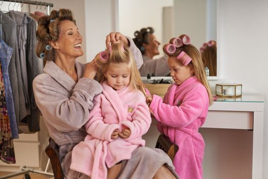 I love doing their hair. A grandmother spending time with her granddaughter.