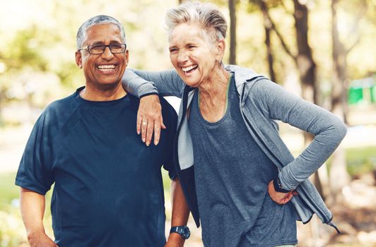 Fitness, funny or old couple of friends in nature laughing at a joke after training, walking or workout. Comic, support or happy senior woman bonding with elderly partner in interracial marriage