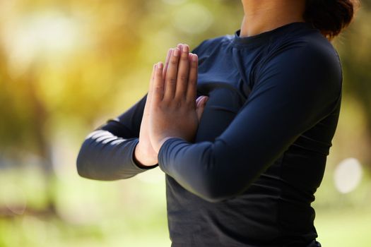 Woman, hands and namaste meditation at park, wellness and freedom of chakra energy, zen fitness or peace. Closeup girl, yoga exercise and praying in nature for mental health, hope and balance mindset