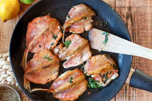 Red mullet fish cooked on a pan