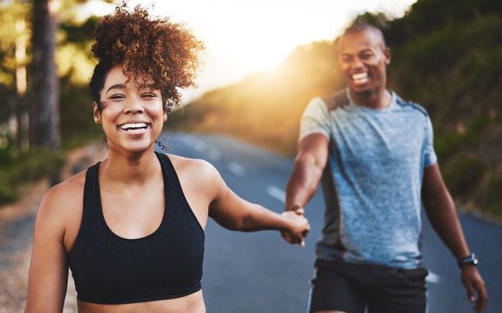 Exercising together is good for your relationship. a happy young couple out for a run together.