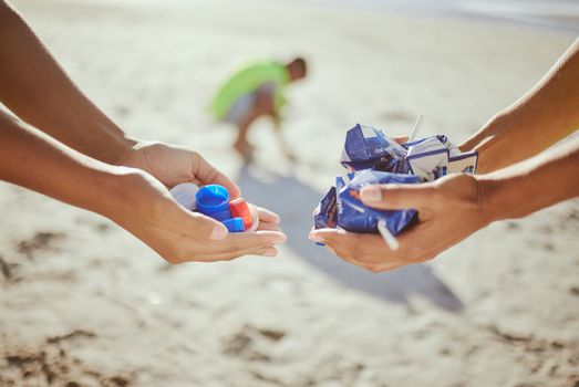 Hands, trash collection and beach clean up help for climate change wellness, environment sustainability or global warming change. Zoom, cleaning people and holding plastic garbage for ocean recycling