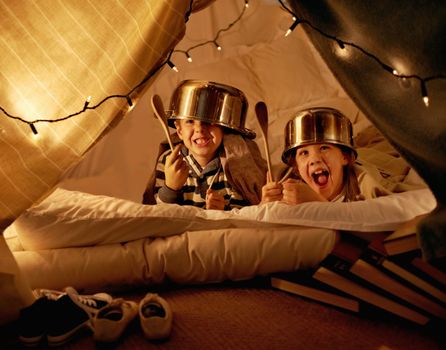 Youll never take us. cute little children with pot helmets in a blanket fort.