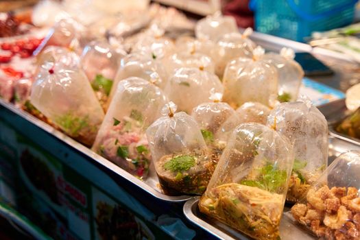 Bags of soup and liquid food at a street food market in Thailand