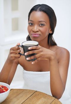 Theres nothing better than my morning coffee. an attractive young woman enjoying her morning off.