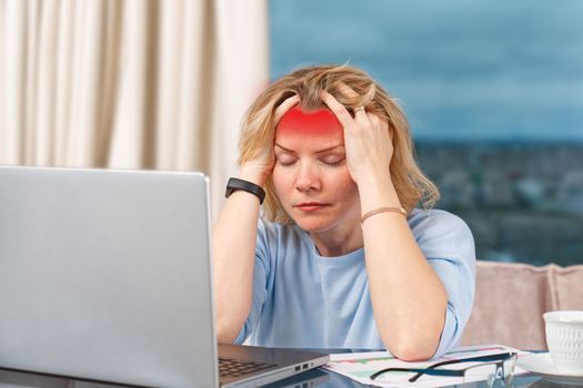 Unhappy tired woman at home office working with laptop. Stress, depression, loneliness, fatigue, burnout concept