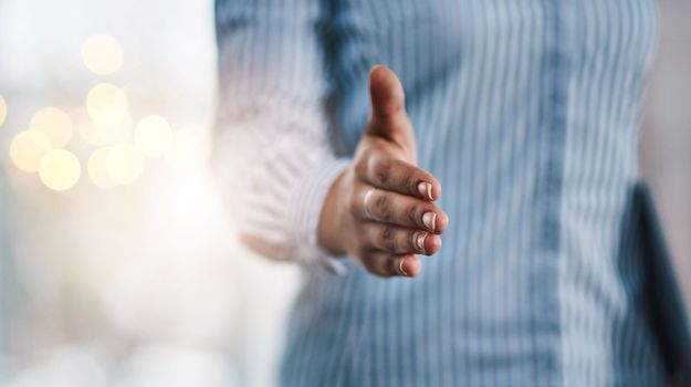 How about we partner up for the best success. Closeup shot of an unrecognizable businesswoman extending a handshake in an office.