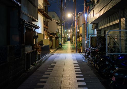 Quiet street in residential Kyoto neighborhood at night