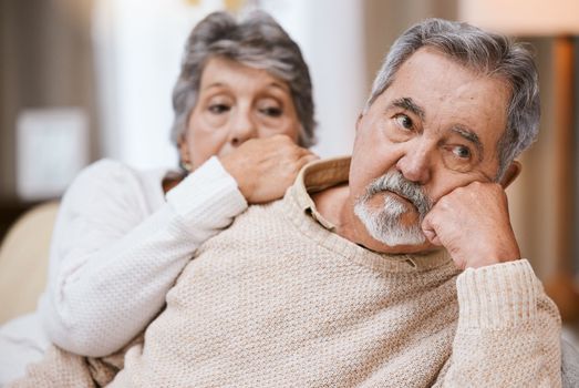 Senior couple, stress and depressed together on home living room couch thinking about divorce, retirement and financial problem or crisis. Old man and woman with conflict in marriage after fight