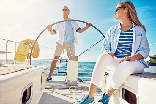 Relax, travel and luxury with couple on yacht for summer, love and sunset on Rome vacation trip. Adventure, journey and man and woman sailing on boat for ocean, tropical and honeymoon at sea