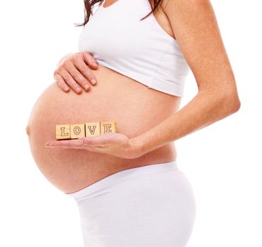 Shes expecting. a pregnant woman isolated on white.