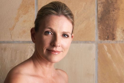 Beautiful in every single way. Cropped studio portrait of a beautiful mature woman with bare shoulders.