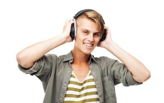 Music is a language we all understand. a young man listening to music.