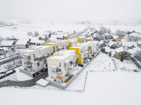 Aerial view of new modern apartment complex on a snowy day