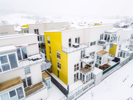 Newly build modern apartments covered in snow on a winter day