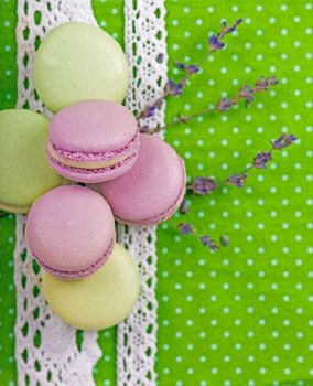 Sweet macaroons on a green napkin, vintage color tone