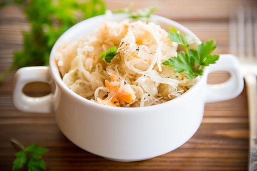 sauerkraut with carrots and spices in a bowl