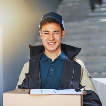 We guarantee a first-rate service. Portrait of a courier making a delivery in an office.