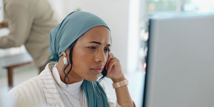 Hijab, headache and business woman burnout at a office computer feeling anxiety and stress. Finance employee, islam and muslim female at work doing tax audit at a computer worried about mistake