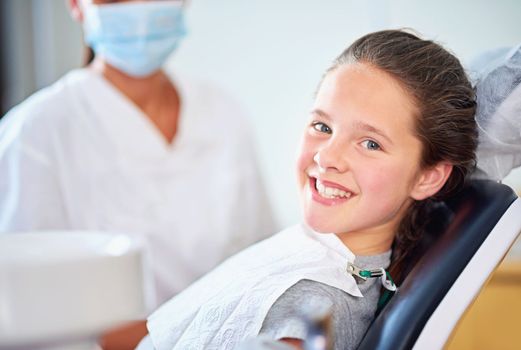 Cavity free smile. a female dentist and child in a dentist office