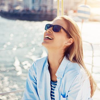 Ocean, cruise and woman on yacht for holiday, summer vacation and weekend getaway in Italy. Travelling lifestyle, sea adventure and happy girl with sunglasses smile, relaxing and enjoying boat trip