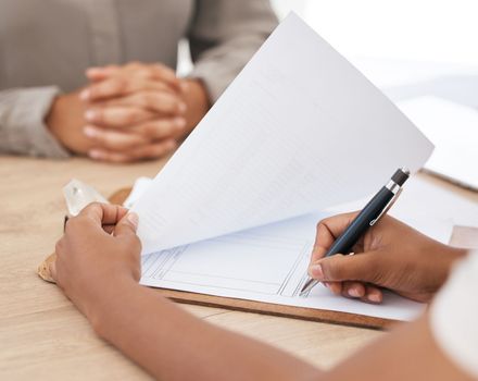 Legal paperwork, signature and document in an office for interview, insurance form or contract with agent during a meeting. Woman writing on paper for healthcare policy, tax or loan application