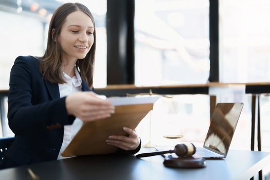 Portrait of a Asian woman lawyer studying a lawsuit for a client before going to court