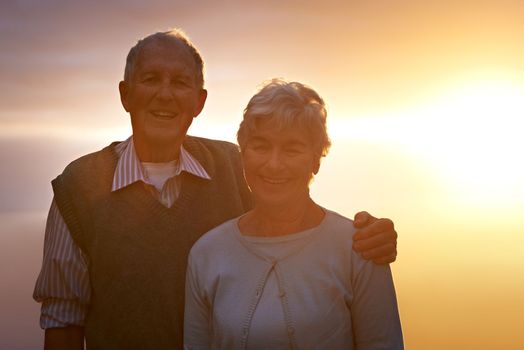 Still together after all these years...Portrait of an elderly couple at sunset.