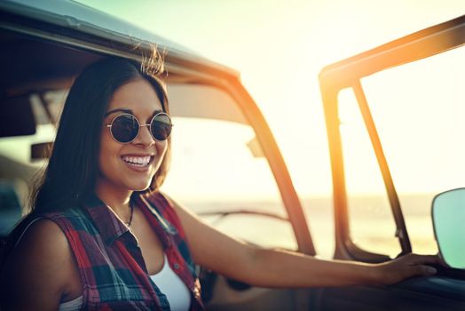 Go find adventure and get more mileage out of life. a young woman enjoying a relaxing roadtrip.