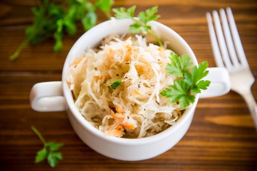 sauerkraut with carrots and spices in a bowl