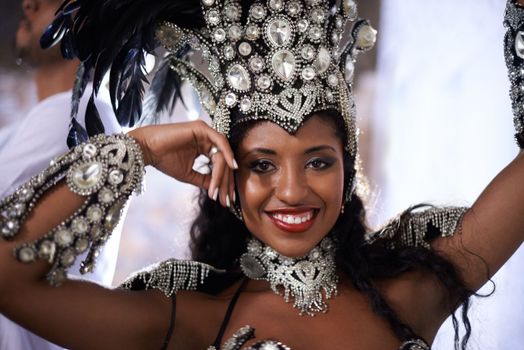 Glamourous dancing queen. Portrait of a beautiful samba dancer performing in a carnival with her band.