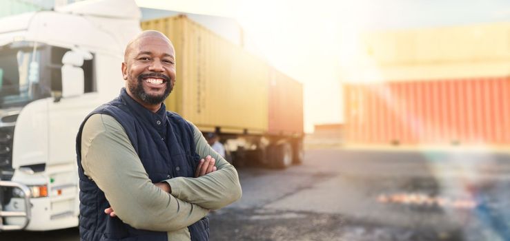 Man, portrait and arms crossed by truck, container stack and happy for transport job. Driver, smile and shipping cargo freight with happiness in transportation service, stock delivery or supply chain
