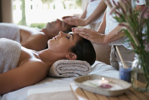 Feeling the healing through their expert hands. a mature couple enjoying a relaxing massage.
