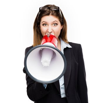 Its my voice and Im not afraid to use it. a young businesswoman using a megaphone against a studio background.