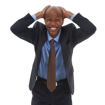 This job is driving me crazy. Studio portrait of a businessman holding his head in frustration isolated on white.