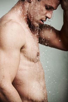 He has a few womens hearts. a sexy young man taking a shower.
